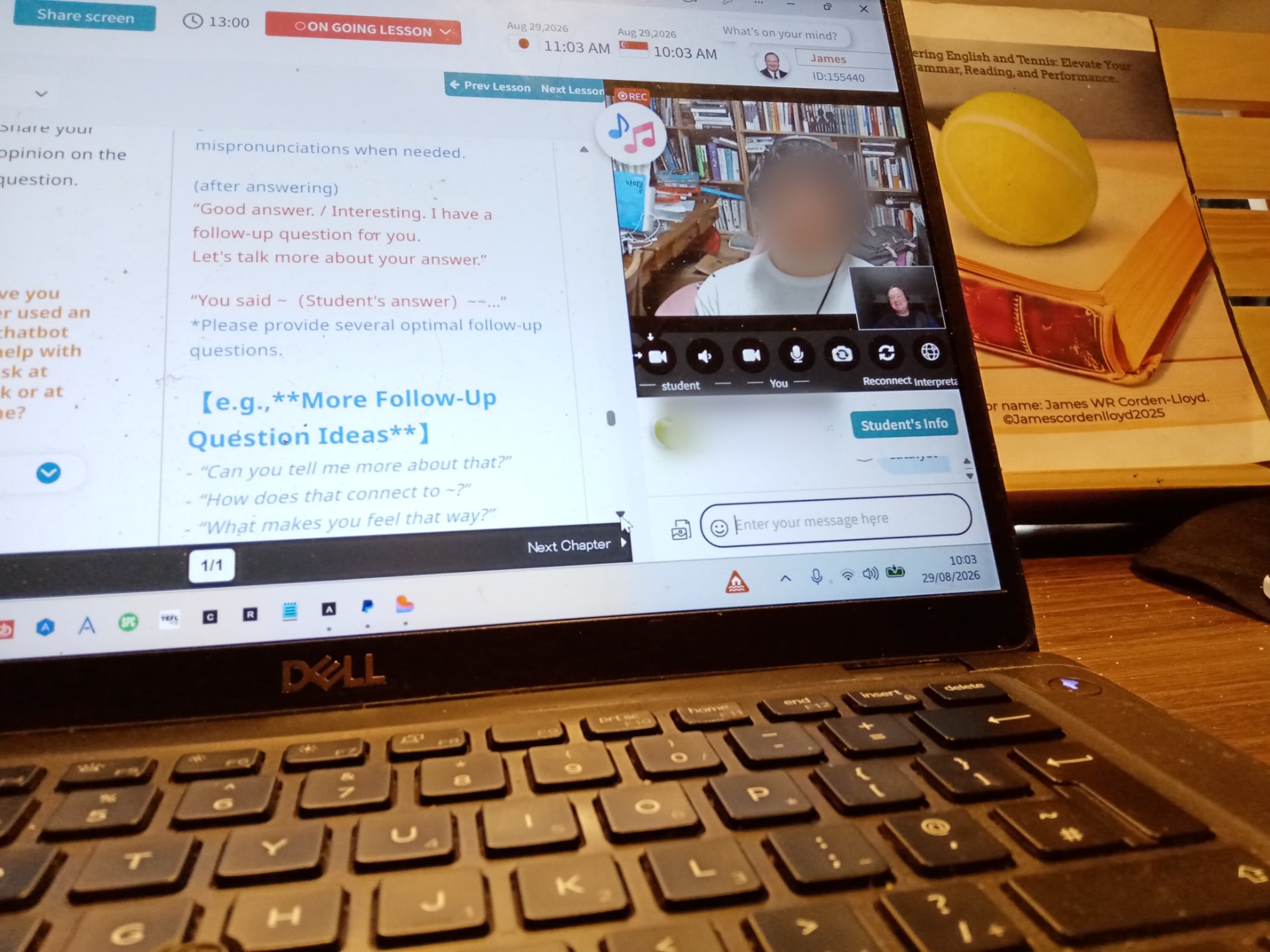 Live one-to-one online English lesson in progress, with lesson notes on screen and the Mastering English and Tennis book beside the laptop